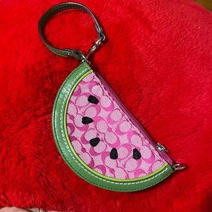 Signature Coach pattern watermelon wristlet coin purse, green leather, pink